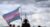 A person holds a flag as the Capitol is seen in the background during a Transgender Day of Visibility rally on the National Mall in Washington on March 31, 2025. (REUTERS/Evelyn Hockstein/File Photo)