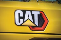 A Caterpillar logo is surrounded by yellow on the side of a tractor in the Building SS assembly facility in East Peoria. (USA TODAY Network)