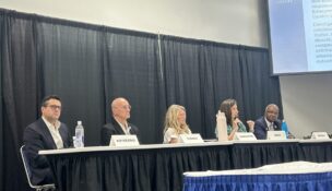 From left: Michael Kuykendall of Cattelus Development Corporation; Loudoun County, Virginia, Board of Supervisors Vice Chair Michael R. Turner; Frederick County Division of Planning and Permitting Director Deborah Carpenter; League of Conservation Voters Director of Climate Policy and Justice Rebecca Rehr; and state Sen. Benjamin Brooks, D-Baltimore County, discuss the costs and benefits of data centers during a panel at the Maryland Association of Counties 2026 summer conference on Aug. 12, 2026. (Hannah Gaskill/The Daily Record)