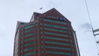 Storm clouds behind the Southeast Baltimore headquarters of CareFirst BlueCross BlueShield.
