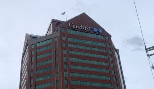 Storm clouds behind the Southeast Baltimore headquarters of CareFirst BlueCross BlueShield.