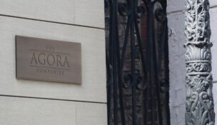 A sign marks the Agora Cos. headquarters in Baltimore's Mount Vernon neighborhood.