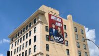 An 'Injured, hon?' ad for WGK Personal Injury Lawyers on the Old Town National Bank building at Fallsway and North Gay Street in downtown Baltimore.