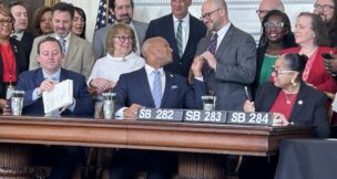 Senate President Bill Ferguson, Gov. Wes Moore and House Speaker Joseline Peña-Melnyk sign the fiscal year 2027 budget on April 8, 2026. (Hannah Gaskill/The Daily Record)