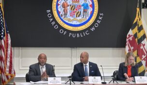 State Treasurer Dereck E. Davis, Gov. Wes Moore and Comptroller Brooke Lierman approve Maryland's annual bond sale on June 3, 2026. (Hannah Gaskill/The Daily Record)