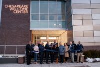 Harford Community College Board of Trustees Chair Brian Walker and Dr. Theresa B. Felder, president of the College (center), are joined by community leaders at the ribbon-cutting ceremony for Harford Community College’s Chesapeake Welcome Center on the evening of January 21. (Lauren Raygor/Ujen Jonchhe)