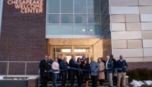Harford Community College Board of Trustees Chair Brian Walker and Dr. Theresa B. Felder, president of the College (center), are joined by community leaders at the ribbon-cutting ceremony for Harford Community College’s Chesapeake Welcome Center on the evening of January 21. (Lauren Raygor/Ujen Jonchhe)