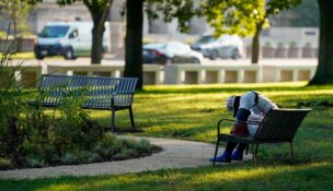 A homeless person sleeps on a bench near the National Mall in Washington, D.C., on Aug. 15, 2025. (REUTERS/Elizabeth Frantz)