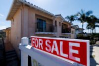 A "for sale" sign is shown for a residential home in Encinitas, California, on July 25, 2025. (REUTERS/Mike Blake/File Photo)