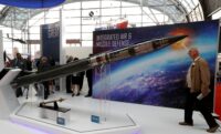 A man looks at a Patriot Advanced Capability (PAC-3) Missile Segment Enhancement (MSE) model by Lockheed Martin at an international military fair in Kielce, Poland, on September 7, 2017. (REUTERS/Kacper Pempel)