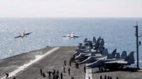 Two F/A-18 Super Hornets launch from the flight deck of the U.S. Navy Nimitz-class aircraft carrier USS Abraham Lincoln in support of the Operation Epic Fury attack on Iran from an undisclosed location March 3, 2026. (U.S. Navy/Handout via REUTERS/File Photo)