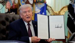 President Donald Trump speaks as he shows a signed executive order on mail ballots, in the Oval Office of the White House in Washington on March 31, 2026. (REUTERS/Evan Vucci)
