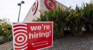 A sign posted outside a Target store states the company is hiring in Encinitas, California, on March 30, 2026. (REUTERS/Mike Blake)