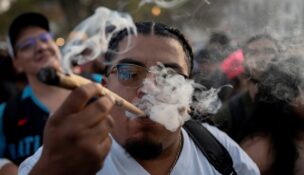A reveller smokes cannabis at the Mile High 420 Festival in Denver on April 20, 2026. (REUTERS/Cheney Orr)