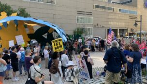 Protesters rally outside of the Edward A. Garmatz United States District Courthouse ahead of a hearing on whether the Trump administration could resume construction on a planned ICE detention facility near Hagerstown