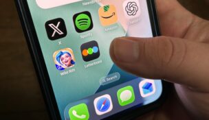 A Georgia man holds his iPhone showing some of the services impacted by a Cloudflare outage on Tuesday, Nov. 18, 2025. (USA TODAY Network via Reuters Connect)