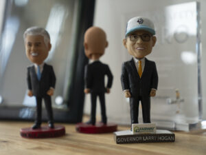 Bobbleheads from Larry Hogan's time as the Maryland governor are now in his Annapolis real estate office. (Maxine Wallace/The Washington Post)