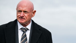U.S. Senator Mark Kelly (D-AZ) looks on at a press conference, on Capitol Hill in Washington, D.C., November 18, 2025. (REUTERS/Annabelle Gordon/File Photo)