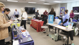 Resource vendors prepare their tables for the event. (Photo by MidAtlantic Photographic and Natalie Pixley)