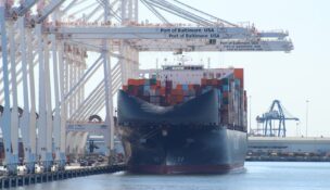 A cargo ship is berthed at the Port of Baltimore as federal authorities announce criminal charges in the Francis Scott Key Bridge collapse on May 12, 2026. (Dan Belson/The Daily Record)