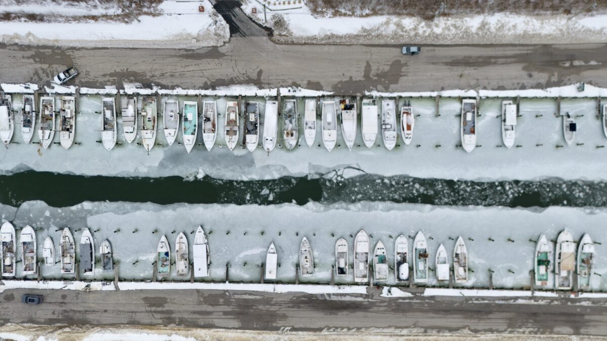 Commercial watermen with boats in the Kent Narrows Boat Basin are locked in their slips during a rough winter this past February. (Photo by Sightlines Aerial Photography)