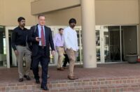 With his clients following behind, Shaun Clarke, an attorney representing seafarers from two ships managed by the same firm as the Dali, leaves the U.S. District Court for Maryland's courthouse in Baltimore following a scheduling hearing.