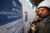 Migrants check their phones while gathering at El Chaparral border crossing after their CBP One app asylum appointment was cancelled on the day of President Donald Trump's inauguration, in Tijuana, Mexico January 20, 2025. (REUTERS/Jorge Duenes)