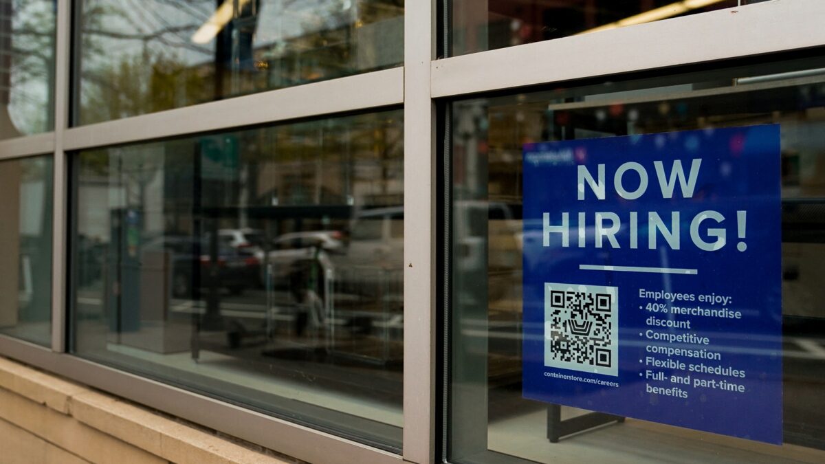 An employee hiring sign with a QR code is seen in a window of a business in Arlington, Virginia, on April 7, 2023. (REUTERS/Elizabeth Frantz)