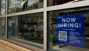 An employee hiring sign with a QR code is seen in a window of a business in Arlington, Virginia, on April 7, 2023. (REUTERS/Elizabeth Frantz)