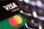Visa and Mastercard credit cards are seen in this illustration taken Feb. 3, 2026. (REUTERS/Dado Ruvic/Illustration)