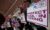Supporters gather outside the federal courthouse after a hearing in a lawsuit brought by a coalition of Democratic state attorneys general seeking to block President Donald Trump's executive order tightening rules on mail-in voting, in Boston on June 2, 2026. (REUTERS/Brian Snyder)