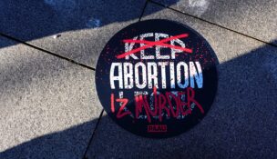 A banner is seen during a protest to ban the abortion pill, outside the U.S. Department of Health and Human Services in Washington on Jan. 22, 2026. (REUTERS/Aaron Schwartz/File Photo)