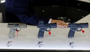 Guns are displayed at an exhibition booth, during the annual National Rifle Association (NRA) meeting in Dallas on May 19, 2024. (REUTERS/Shelby Tauber/File Photo)