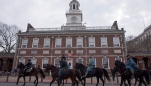 A group of horseback riders dressed as Union soldiers pass in front of Independence Hall in Philadelphia on Feb. 12, 2015. (REUTERS/Charles Mostoller/File Photo)