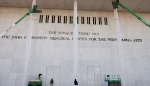 The newly added lettering for President Donald Trump's name is displayed at the facade of the John F. Kennedy Center for the Performing Arts, a day after its board announced it would rename the institution The Donald J. Trump and The John F. Kennedy Memorial Center for the Performing Arts, in Washington on Dec. 19, 2025. (REUTERS/Kevin Lamarque)