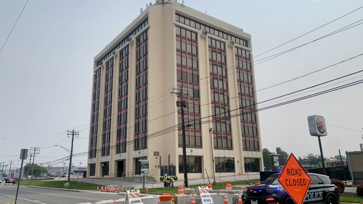 Anne Arundel County Police block off the collapse zone around Empire Towers, the 10-story office building in Glen Burnie that was condemned as unsafe last week after being compromised during unpermitted construction in the garage.
