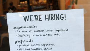 A hiring sign is seen in a cafe as the U.S. Labor Department released its July employment report, in Manhattan, New York City, U.S., August 5, 2022. (REUTERS/Andrew Kelly)