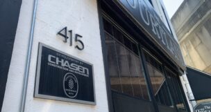 A sign at The Courtland, a 15-unit former Chasen Cos. apartment building in downtown Baltimore, bears the name of the collapsed real estate business.