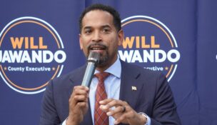 Montgomery County Councilmember Will Jawando campaigns in June for county executive. Jawando was one of a number of county executive hopefuls who took advantage of public financing this year, and the only one to win his primary. (Photo by William J. Ford/Maryland Matters)