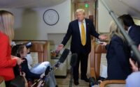 President Donald Trump speaks to reporters mid-flight in the press cabin of the new, Qatari-gifted Air Force One after changing planes to return to Washington from RAF Mildenhall, Britain, on July 8, 2026. (REUTERS/Jonathan Ernst/File Photo)
