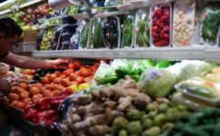 A person arranges groceries in El Progreso Market in the Mount Pleasant neighborhood of Washington on Aug. 19, 2022. (REUTERS/Sarah Silbiger)