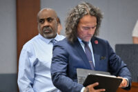Duane Davis looks on as his attorney Michael Sanft checks his computer during the first day of jury selection in the murder trial related to the 1996 killing of rapper Tupac Shakur at Clark County District Court Regional Justice Center in Las Vegas, Nevada, August 10, 2026. (David Becker/Pool via REUTERS)