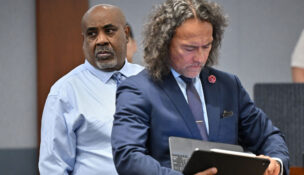 Duane Davis looks on as his attorney Michael Sanft checks his computer during the first day of jury selection in the murder trial related to the 1996 killing of rapper Tupac Shakur at Clark County District Court Regional Justice Center in Las Vegas, Nevada, August 10, 2026. (David Becker/Pool via REUTERS)