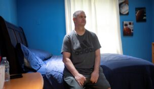 Richie Rosen, a resident of a facility that houses people with developmental disabilities, where three Haitian caregivers who held Temporary Protected Status (TPS) worked until the Supreme Court decision ended TPS for Haitians, poses for a portrait in New City, New York, on Aug. 11, 2026. (REUTERS/Vincent Alban)