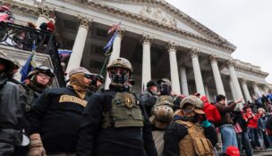 Members of the Oath Keepers militia group stand among supporters of President Donald Trump occupying the east front steps of the U.S. Capitol in Washington on Jan. 6, 2021. (REUTERS/Jim Bourg/File Photo)