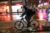 A food delivery rider rides a bicycle through the rain during a delivery in midtown Manhattan, New York, on Sept. 23, 2021. (REUTERS/Angus Mordant/File Photo)