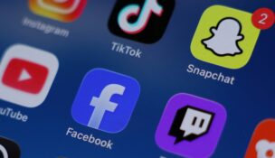 Instagram, TikTok, Snapchat, YouTube, Facebook, Twitch and Reddit applications are displayed on a mobile phone in this picture illustration taken on Dec. 9, 2025. (REUTERS/Hollie Adams/Illustration)