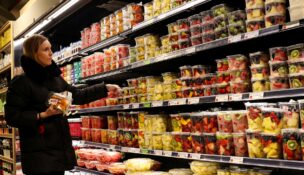 A woman shops for fruit in a store in New York City on Feb. 12, 2025. (REUTERS/Brendan McDermid)